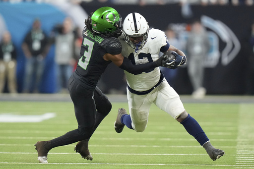 Top-ranked Oregon defeats third-ranked Penn State 45-37, securing Big Ten championship and playoff opening round bye.