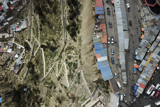 Shamans in Bolivia resist leaving unstable cliffside dwellings despite official evacuation mandate.