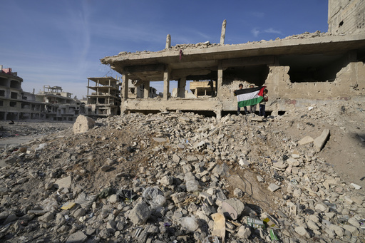 Palestinian displaced individuals make their way back to Yarmouk, raising concerns about their status in the evolving Syria.