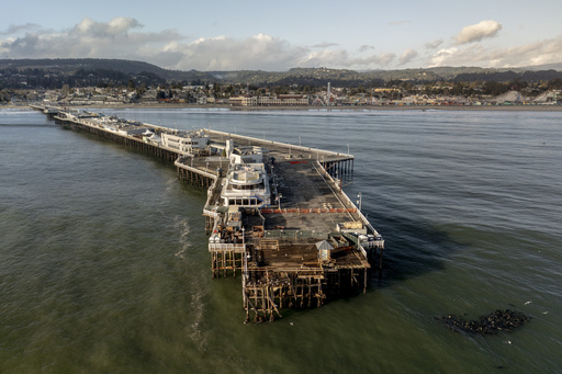 California residents anxious as dangers of high surf and flooding continue on Christmas Eve