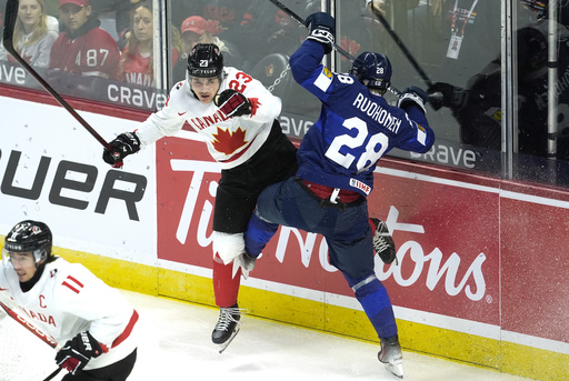 Cole Hutson contributes 5 assists as defending champion USA overwhelms Germany 10-4 in world junior hockey debut