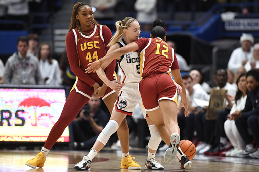 JuJu Watkins and No. 7 USC narrowly defeat Paige Bueckers and the fourth-ranked UConn 72-70.