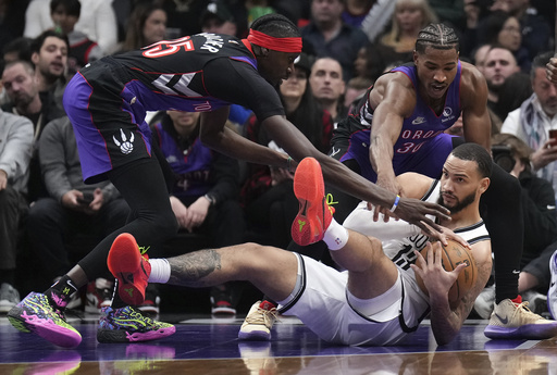 Johnson scores clutch 3-pointer and tallies 15 of his 33 points in the final quarter as Nets come back to defeat Raptors