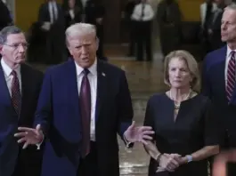 President-elect Donald Trump, flanked by Sen. John Barrasso, R-Wyo., left, Sen. Shelley Moore Capito, R-W.Va., second from right, and Senate Majority Leader John Thune of S.D., right, talks to reporters after a meeting with Republican leadership at the Capitol on Wednesday, Jan. 8, 2025, in Washington. (AP Photo/Steve Helber)