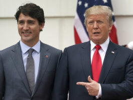 FILE - President Donald Trump and Canadian Prime Minister Justin Trudeau pose for a photo as Trudeau arrives at the White House in Washington, on Oct. 11, 2017. (AP Photo/Carolyn Kaster, File)