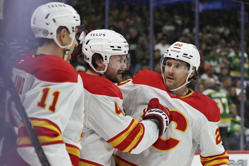 Kuzmenko nets a pair as Flames fend off Wild to secure a 5-4 victory