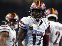 Washington Commanders wide receiver Terry McLaurin (17) reacts to a reception against the Detroit Lions during the second half of an NFL football divisional playoff game, Saturday, Jan. 18, 2025, in Detroit. (AP Photo/Seth Wenig)