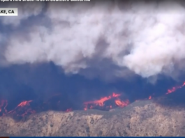 Fire threatens communities near LA.