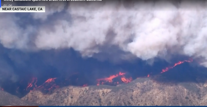 Fire threatens communities near LA.