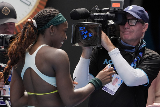 Coco Gauff inscribes ‘RIP TikTok USA’ on a television camera during the Australian Open