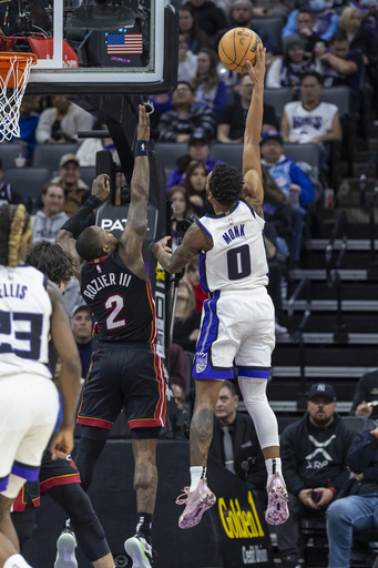 DeRozan excels while Kings edge out Heat 123-118 in double overtime