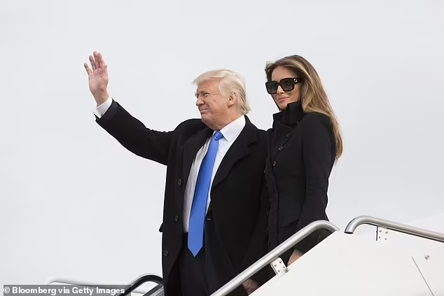 First Lady Melania will wear an American designer – the current favourite is Carolina Herrera for her daytime outfit – but is said to have curated her own gown for tomorrow night's official inauguration ball (pictured during the 2017 inauguration day)

