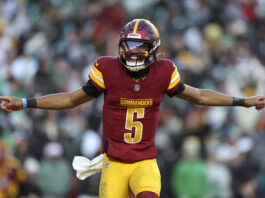 LANDOVER, MARYLAND - DECEMBER 22: Jayden Daniels #5 of the Washington Commanders celebrates during a game against the Philadelphia Eagles at Northwest Stadium on December 22, 2024 in Landover, Maryland. The Commanders defeated the Eagles 36-33. (Kara Durrette/Getty Images)