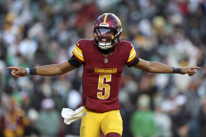 LANDOVER, MARYLAND - DECEMBER 22: Jayden Daniels #5 of the Washington Commanders celebrates during a game against the Philadelphia Eagles at Northwest Stadium on December 22, 2024 in Landover, Maryland. The Commanders defeated the Eagles 36-33. (Kara Durrette/Getty Images)