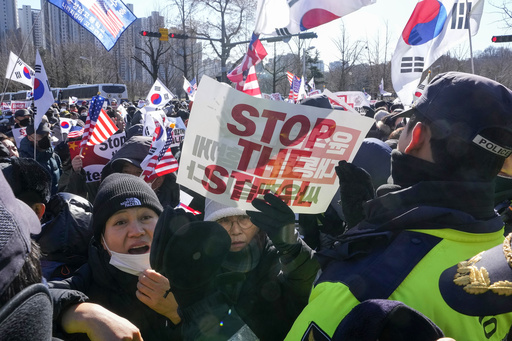 Former South Korean President Yoon Suk Yeol detained following interrogation after impeachment.