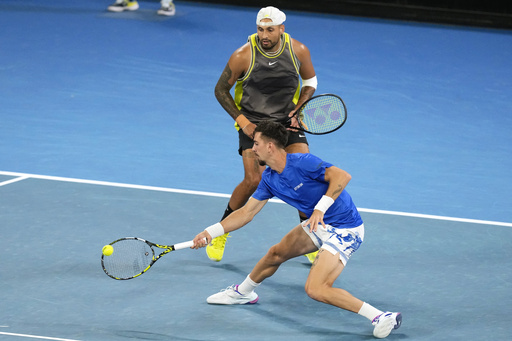 Nick Kyrgios and Thanasi Kokkinakis exit their doubles match at the Australian Open