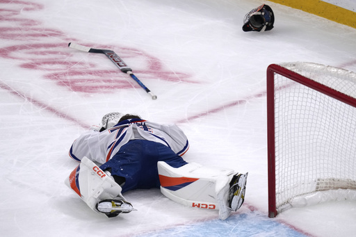 Oilers’ netminder Stuart Skinner exits the game momentarily following incident with Bruins’ Nikita Zadorov