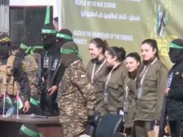 Hamas militants handed over four captive female Israeli soldiers to the Red Cross in Gaza City on Saturday after parading them in front of a crowd (Photo: BBC News/video)