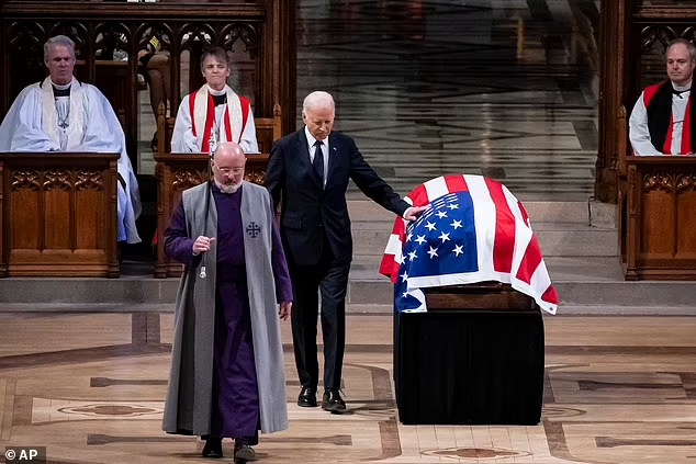 President Joe Biden touches the casket of former President Jimmy Carter after delivering remarks during Carter's state funeral at the National Cathedral, Thursday, Jan. 9, 2025, in Washington

