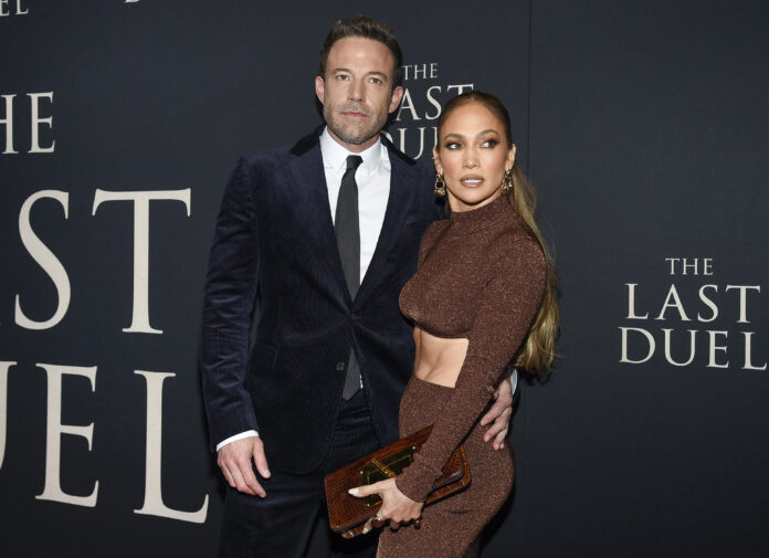 FILE - Actor Ben Affleck, left, and actor-singer Jennifer Lopez attend the premiere of 