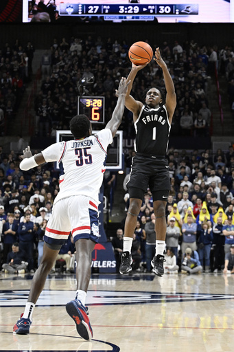 UConn, ranked 11th, rallies from a 14-point hole to defeat Providence 87-84, remaining perfect in Big East play.