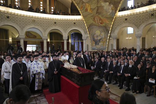 Numerous Albanians gather to honor Orthodox Christian Archbishop Anastasios.