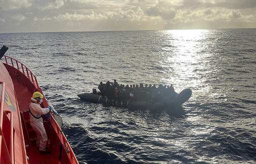 Image shows the rescue of a newborn during perilous maritime journey to Spain’s Canary Islands.