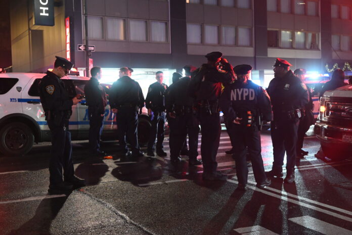 MANHATTAN, NEW YORK, UNITED STATES - JANUARY 1: Multiple police officers and EMS units arrived on scene after another person was stabbed in a second stabbing attack in Times Square at West 49th Street and 8th Avenue around 2:00 AM following a separate attack an hour apart at West 36th Street and 8th Avenue on New Year's Day, Wednesday, January 1, 2025. NYPD officers responded to the scene where one person was severely wounded in the second stabbing attack as revelers exited Times Square festivities. No other information was immediately released as authorities investigated. Authorities are searching the area for evidence at the crime scene, large pools of blood were found at the crime scene and a weapon was recovered along with suspects being taken into custody. (Photo by Kyle Mazza/Anadolu via Getty Images)