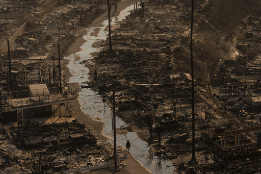 Firefighters seek relief from strong winds intensifying destructive wildfires in the Los Angeles region.