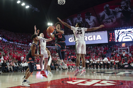 Top-ranked Auburn narrowly defeats No. 23 Georgia 70-68.