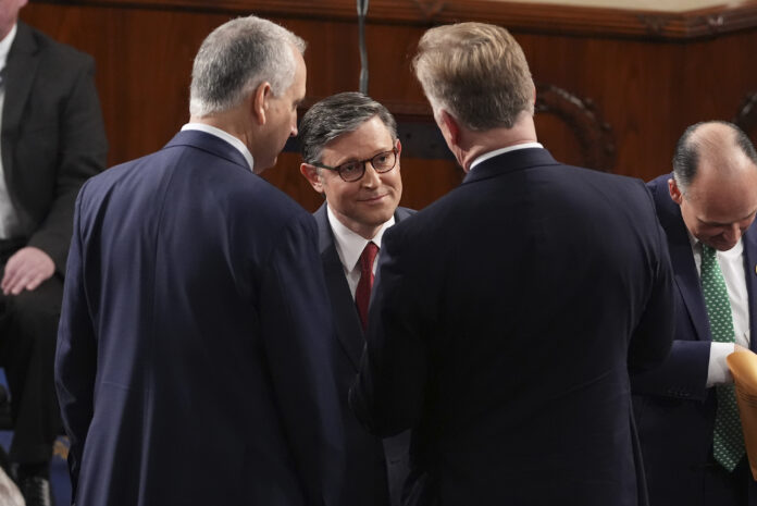 House Speaker Mike Johnson, R-La., speaks with members as the House of Representatives meets to elect a speaker and convene the new 119th Congress at the Capitol in Washington, Friday, Jan. 3, 2025. (AP Photo/Jacquelyn Martin)