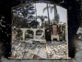 The charred home of Demmi Choo, 31, and her husband Gene Huang Lee, 32, can be seen off Braeburn Road in Altadena, Calif. on Friday, Jan. 10, 2024. Choo and her husband were out of the country when they received the news that flames from the Eaton Fire destroyed their home. The couple moved to the Altadena neighborhood in 2021. "We bought a house, and then we got married that year," said Choo. "We were so excited, because it's our first home together…It was going to be our forever home."(Brontë Wittpenn/San Francisco Chronicle via AP)