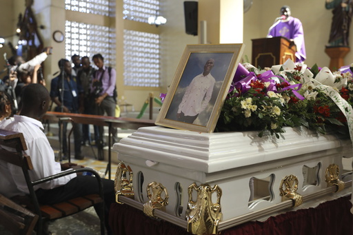 Funeral held for journalist murdered in one of Haiti’s deadliest assaults on the press.