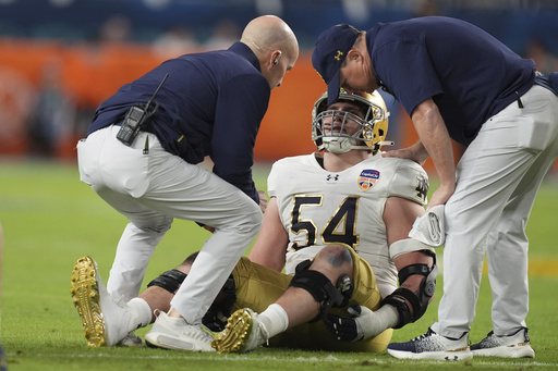 Notre Dame secures title game spot with 27-24 victory over Penn State, featuring late interception and field goal.