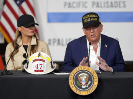 President Donald Trump and first lady Melania Trump participate in a briefing as they tour the Pacific Palisades neighborhood affected by recent wildfires in Los Angeles, Friday, Jan. 24, 2025. (AP Photo/Mark Schiefelbein)