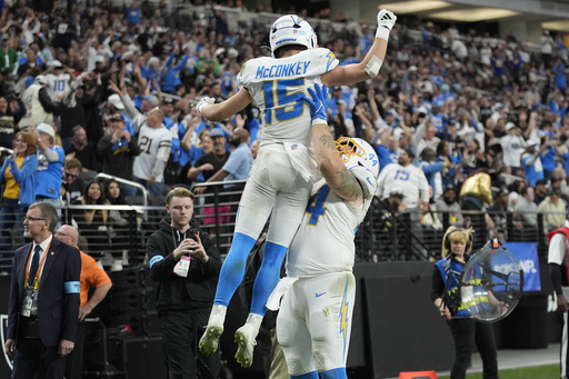 Justin Herbert leads Chargers to 34-20 victory over Raiders, clinching AFC’s fifth seed.