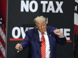 FILE - Republican presidential nominee former President Donald Trump dances at a campaign event at the Cobb Energy Performing Arts Centre, Oct. 15, 2024, in Atlanta. (AP Photo/John Bazemore, file)