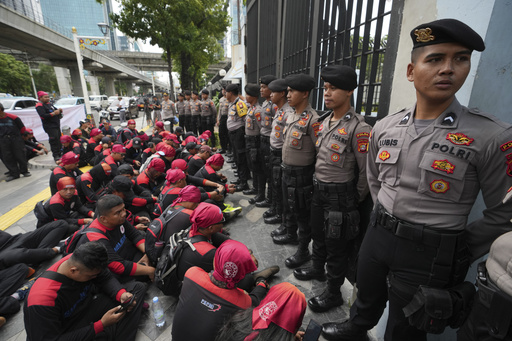 Demonstrators throw eggs at Malaysian embassy in response to shooting of Indonesian migrant worker.