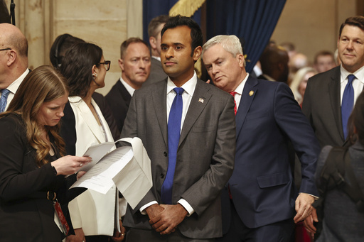 Vivek Ramaswamy, center, arrives before the 60th Presidential Inauguration in the Rotunda of the U.S. 