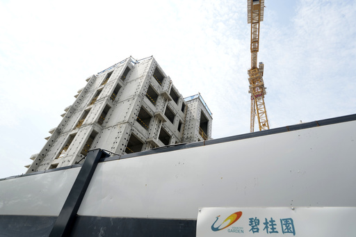 Country Garden, a Chinese real estate firm, seeks agreement with creditors amid stagnant industry conditions.