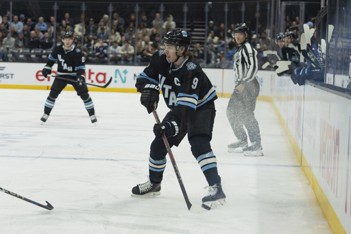 Clayton Keller of Utah leaves game against Jets in the second period after being hit in the face by a puck.