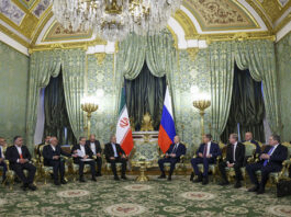 Russian President Vladimir Putin, center right, and Iranian President Masoud Pezeshkian, center left, attend talks at the Kremlin in Moscow, Russia, Friday, Jan. 17, 2025. (Evgenia Novozhenina/Pool Photo via AP)