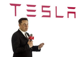 BEIJING, CHINA - OCTOBER 23: (CHINA OUT) Elon Musk, Chairman, CEO and Product Architect of Tesla Motors, addresses a press conference to declare that the Tesla Motors releases v7.0 System in China on a limited basis for its Model S, which will enable self-driving features such as Autosteer for a select group of beta testers on October 23, 2015 in Beijing, China. The v7.0 system includes Autosteer, a new Autopilot feature. While it's not absolutely self-driving and the driver still need to hold the steering wheel and be mindful of road conditions and surrounding traffic when using Autosteer. When set to the new Autosteer mode, graphics on the driver's display will show the path the Model S is following, post the current speed limit and indicate if a car is in front of the Tesla. (Photo by Visual China Group via Getty Images/Visual China Group via Getty Images)