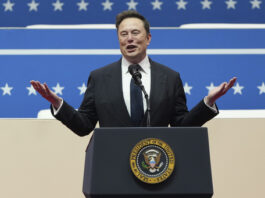 Elon Musk speaks at an indoor Presidential Inauguration parade event in Washington, Monday, Jan. 20, 2025. (AP Photo/Matt Rourke)