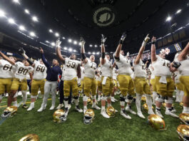 Notre Dame players celebrate after quarterfinal game against Georgia in a College Football Playoff