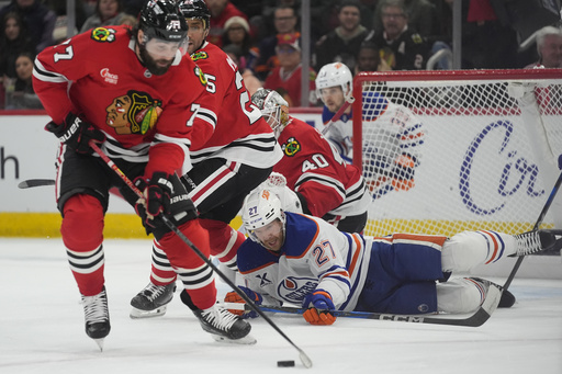 Hyman nets goal in the final period as Oilers comeback to defeat Blackhawks 4-3