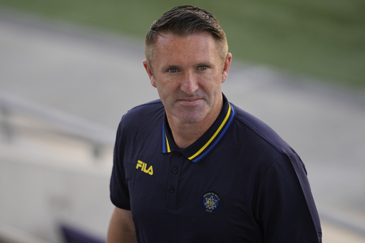 Robbie Keane, the renowned Irish soccer legend, appointed as coach of Hungary’s title-winning Ferencvaros.