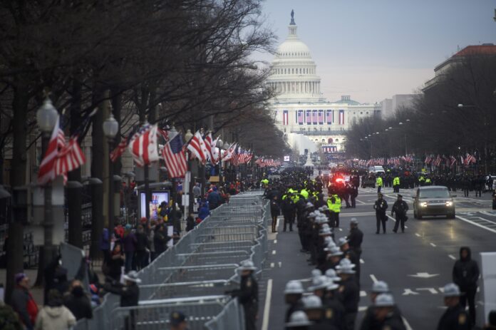 WASHINGTON, DC - JANUARY 20: Police line the streets in front of the Trump International Hotel, with the Capitol Building in the distance, before the inauguration of Donald Trump as the 45th President of the United States January 20, 2016 in Washington D.C. Hundreds of thousands of people are expected to attend. (Photo by Mark Makela/Getty Images)