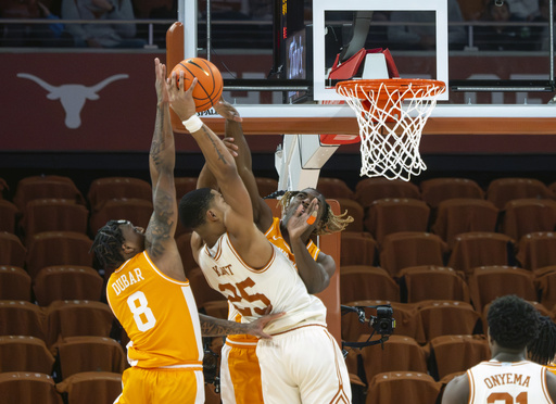 Zeigler and top-ranked Tennessee bounce back from a large deficit to secure a 74-70 victory over Texas.