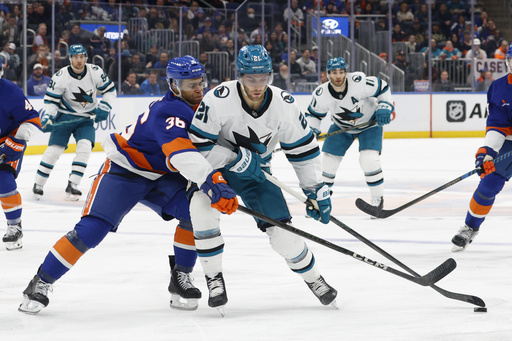 Islanders secure 4-1 victory over Sharks with Barzal and Nelson contributing goals and assists.